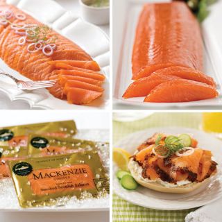 Shop now Smoked Salmon Lovers Sampler, featuring Ducktrap River Kendall Brook Smoked Salmon (top left), Mackenzie Smoked Salmon Tenderloin (top right), Mackenzie Scottish Smoked Salmon (bottom left), and Ducktrap River Pastrami Style Smoked Salmon (bottom right). Photo